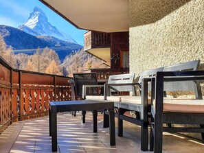 Table, Sky, Building, Property, Furniture, Shade, Wood, Lighting, Interior Design, Architecture