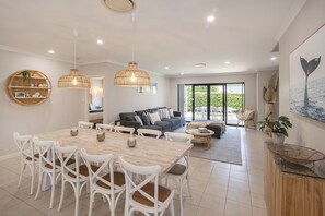 Share meals, laughter, and memories at the spacious dining table, complemented by a warm, coastal-inspired ambience and easy indoor-outdoor flow.