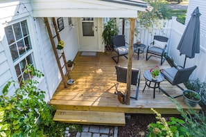 Enjoy the summer splendor on the covered deck.