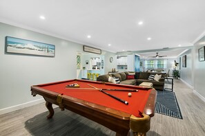 classic pool table in nautical family room 