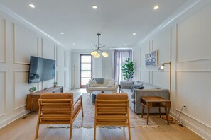 The kitchen opens up into a bright and cozy living room.