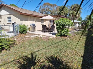 Large Patio with BBQ Grill and Table. Private fenced backyard 