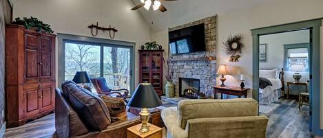 Fantastic living room with sliding door deck access. Huge tv and queen sleeper sofa. Gas fireplace