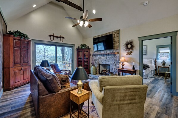 Fantastic living room with sliding door deck access. Huge tv and queen sleeper sofa. Gas fireplace