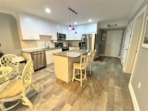 Spacious kitchen with microwave and dishwasher