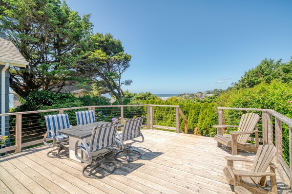 Spacious deck with views looking toward the coastline.