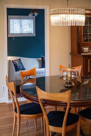 Dining steps down to a den with laundry - couch can fold out creating Bedroom 3