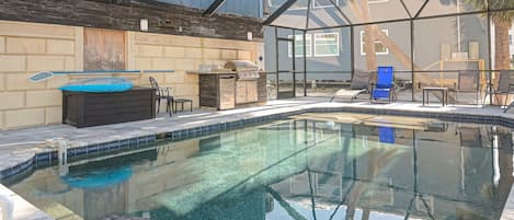 Large, private pool that is always heated! Outdoor kitchen and lost of seating