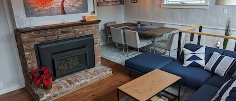 Living room showing fireplace and dining area