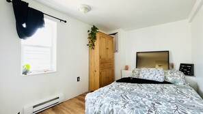 Modest Bedroom with window to the street. Soft Full bed with a comfy duvet!
