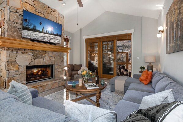 Living Room with a sectional sofa and 65" Sony Smart TV - Fireplace is not operational