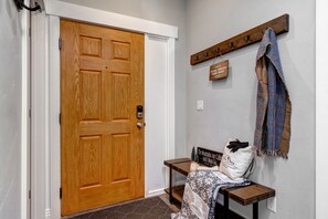 Front Door Entryway with convenient bench and equipment hooks