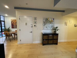 Enterance to apartment with peephole, door buzzer system- Voice, camera, unlock.