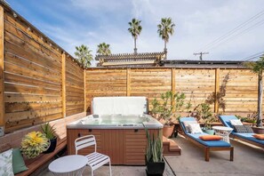 Relax with a drink or two in the inviting hot tub
