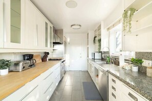 The gourmet kitchen comes fully equipped with everything you could need
