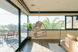 The hanging chair is the perfect place to curl up with a good book