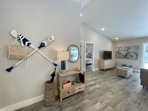 Entryway flows to an open concept living room