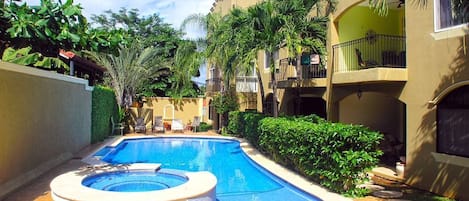 Pool surrounded by tropical garden 