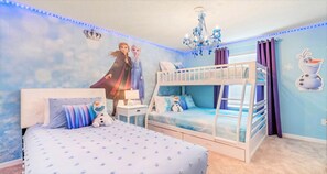 Relax in style in our cozy Elsa Themed queen bedroom, providing you with a comfortable retreat after a day of adventure.