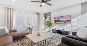 Spacious living room area with cozy sofa, perfect for family reunion
