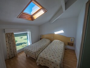 The second bedroom contains 2 comfortable Single beds.