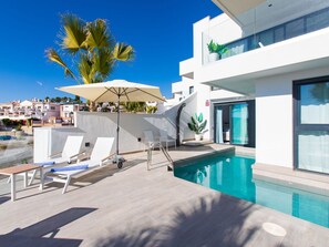 Sky, Building, Property, Swimming Pool, Blue, Azure, Outdoor Furniture, Shade, Condominium, Window