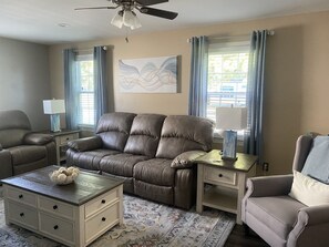 Living room with comfortable power reclining furniture.