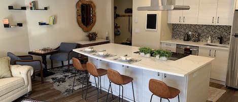 Oversize Quartz Island with 6 chairs can be casual or fancy. 