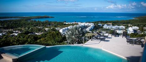 View from the pool deck to the lounge area and out to the Atlantic & Caribbean Seas!  (not a hot tub - it's a multi level pool)