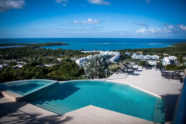 View from the pool deck to the lounge area and out to the Atlantic & Caribbean Seas!  (not a hot tub - it's a multi level pool)