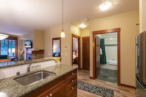 Spacious living room with a cozy fireplace—perfect for après-ski relaxation!