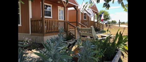 Alamo cabin in forefront.  We have several other cabins and camping too