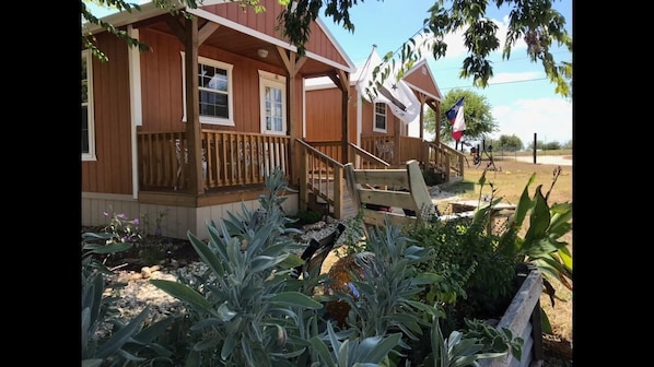 Alamo cabin in forefront.  We have several other cabins and camping too