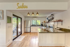 Open layout fully appointed eat in kitchen with 3 barstools & Separate Dining Table with 6 person seating.