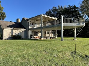 Plenty of outdoor furniture, gas powered grill, and a fire pit. 