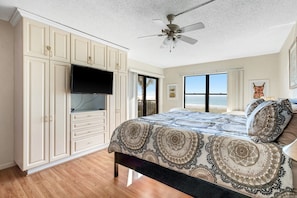 Master bedroom  with beach view and balcony access