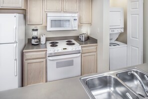 The kitchen provides everything you need to cook and serve up a meal