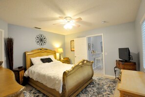 The master bedroom features a luxurious sleigh bed.