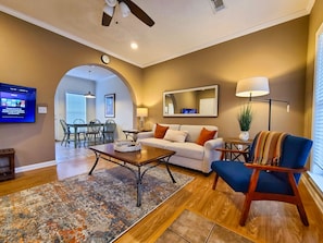 The living room provides comfort and coziness with lots of natural light