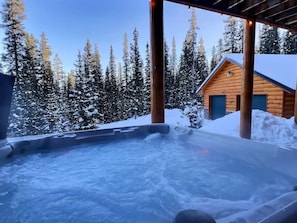 Unwind in our brand-new hot tub, nestled against the forest backdrop, for a serene and secluded relaxation experience.