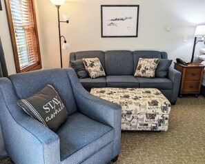 Living area, Queen sleeper sofa, Storage Ottoman with blankets and sheets