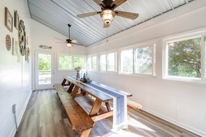 The sunroom offers plenty of seating perfect for large family meals! No AC out here....only Tennessee River breezes and large ceiling fans.