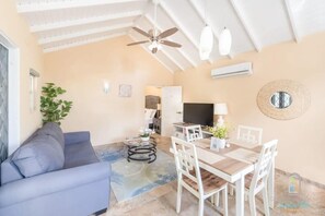Cozy living space w/dining table for 4 to enjoy meals at home.