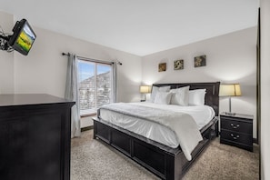 Recharge in the master bedroom where a comfortable king-size bed and lovely views from the window await you.