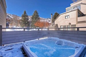 Private outdoor deck with a deluxe hot tub