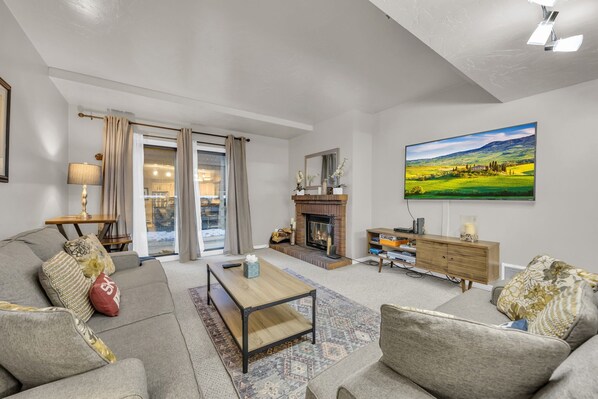 Living room: TV with cable, wood-burning fireplace (starter bundle of wood provided), electric baseboard heating, no A/C