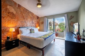 Master suite with king bed, TV and en suite bathroom