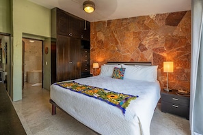 Master suite with king bed, TV and en suite bathroom