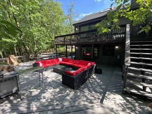 THE DECK WITH THE STAIRS TO THE LIVING ROOM 