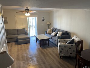 Couch to the left is being removed before it’s rented